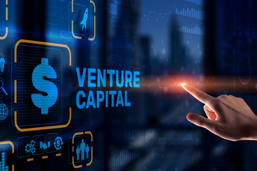 A venture capital investor businessman touching a virtual screen.