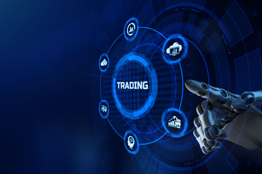 A robotic arm touching a trading button illustrates trade finance automation.